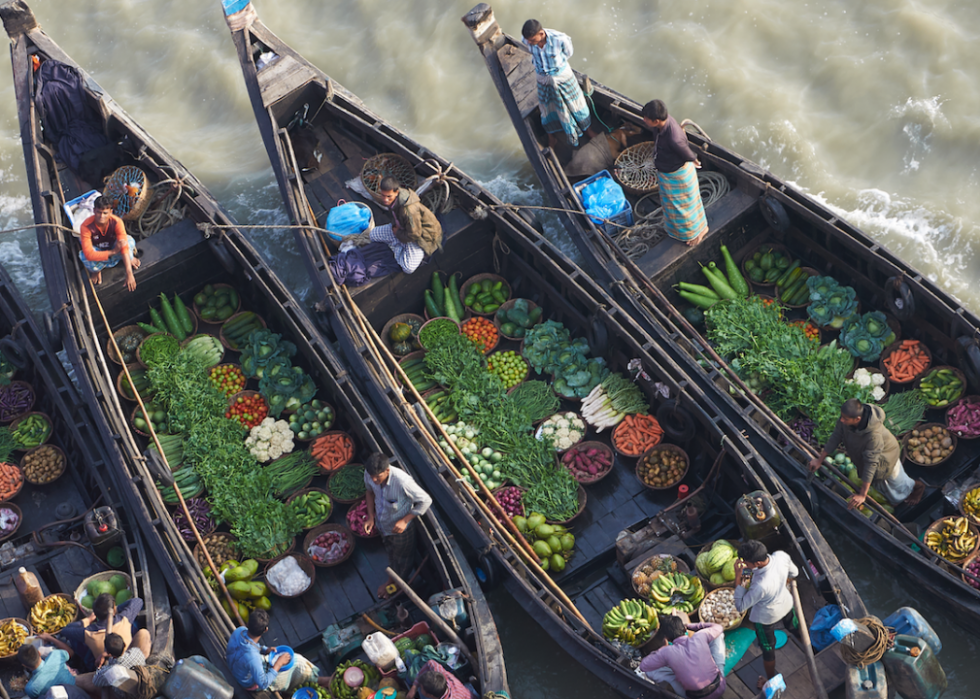 Boats filled with fresh produce on a river in Bangladesh.