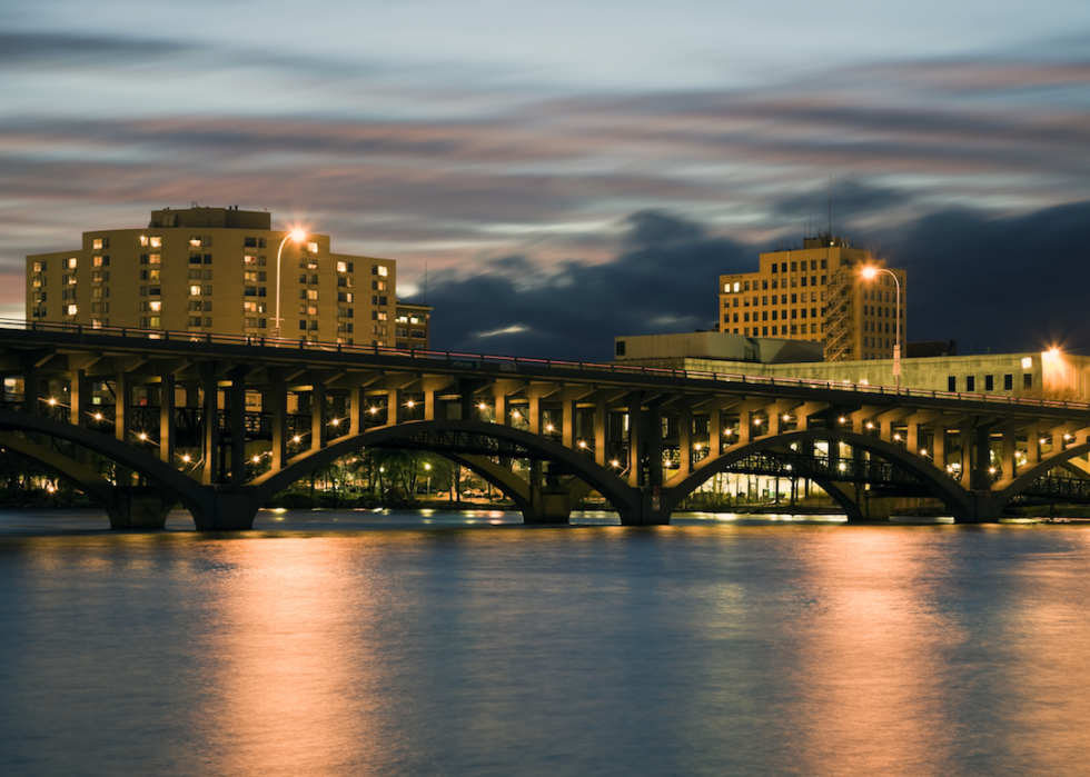 The skyline and bridge over a frozen river.