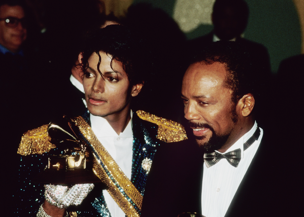 Michael Jackson and Quincy Jones pose with their Grammys on Feb. 28, 1984, at the Grammy Awards in Los Angeles.
