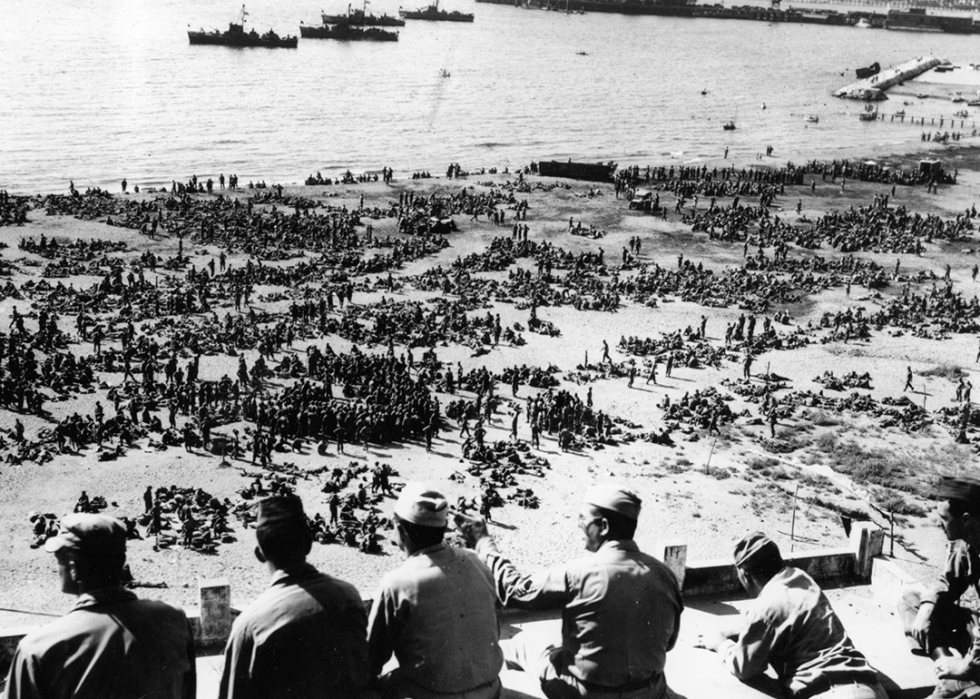 Thousands of US troops waiting on an Italian beach to board landing craft for Southern France.