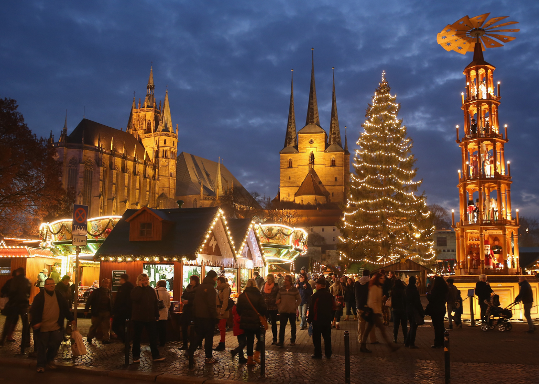 Visitors gather at the Christmas market on Domplatz square in Erfurt.