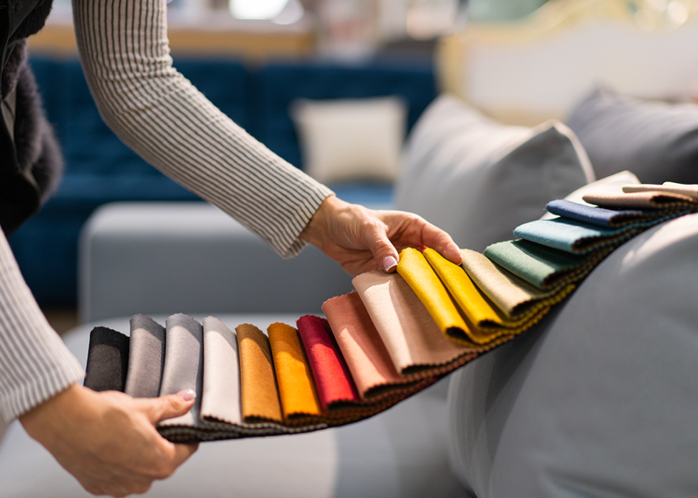 Woman choosing upholstery fabric.