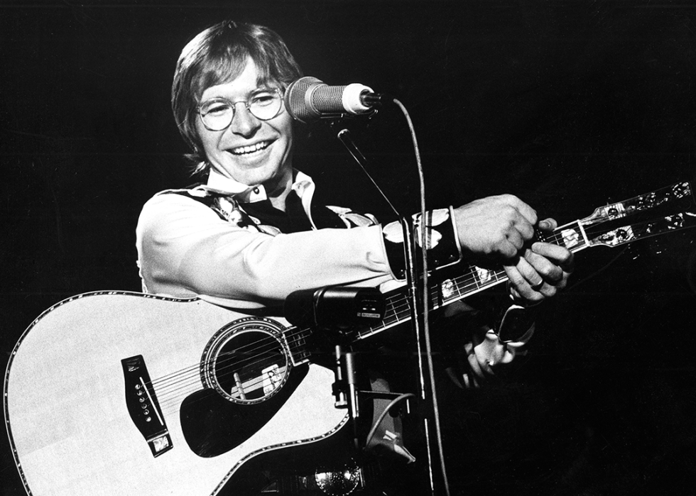 John Denver performs live at the Jaap Eden Hall in Amsterdam.