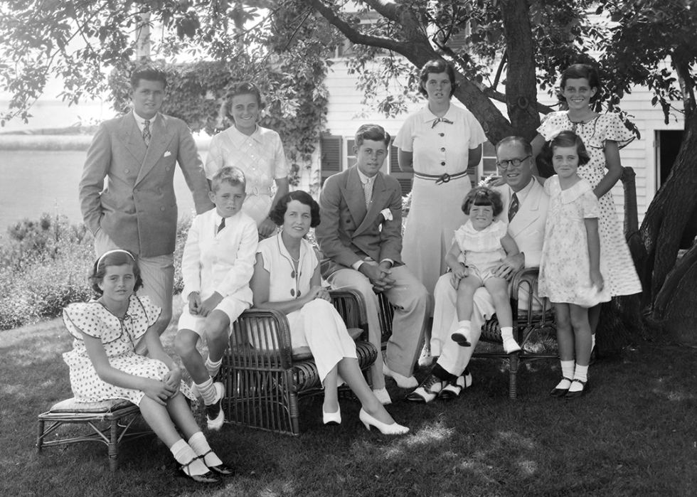 Colorized image of the Kennedy family, with an adolescent JFK in the center, posing for a portrait in Hyannis, Massachusetts.