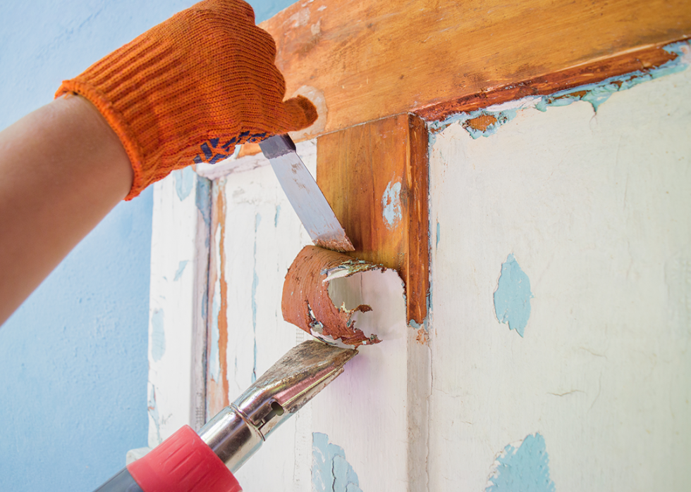 Removing old paint from door.