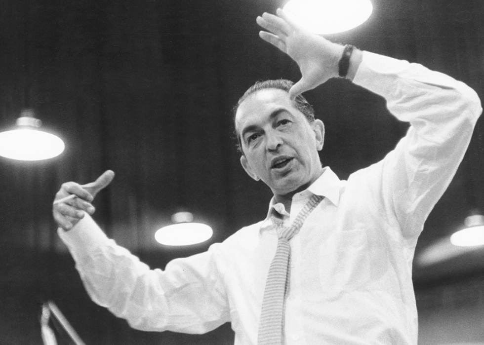 Low angle shot of Percy Faith conducting.