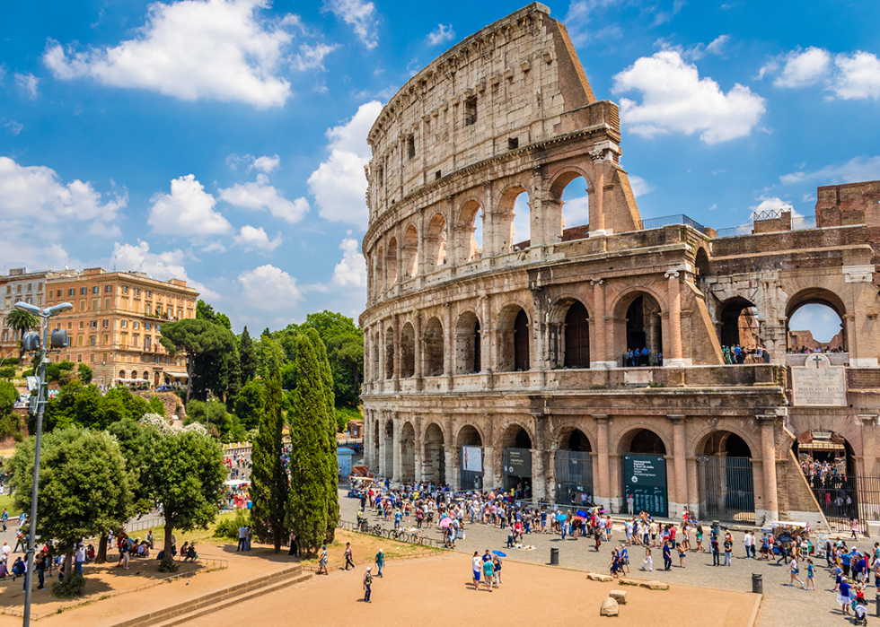 Elevated view of the Colosseum with blue sky.