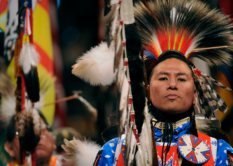 Nathan Chasing Horse of Rosebud leads the color guard during the 37th annual Denver March Pow Wow.
