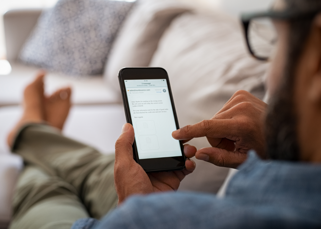 Man reading email on phone.