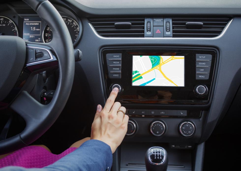 A driver navigates a built-in GPS system.