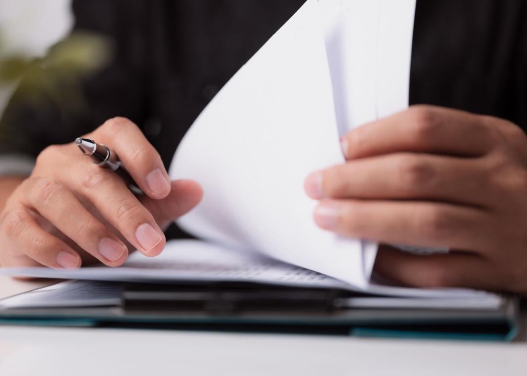 Close up of person reviewing documents