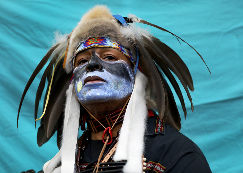 Asantea Eagleface, of the Cheyenne tribe, poses for a portrait during the Two-Spirit Powwow.