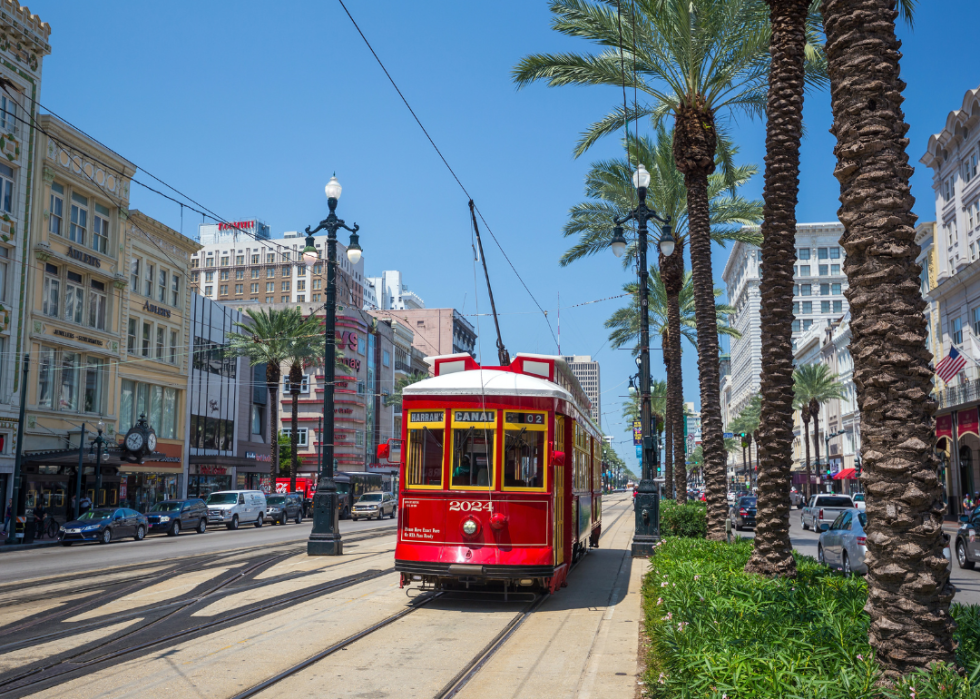 Red streetcar on Canal Street in New Orleans.