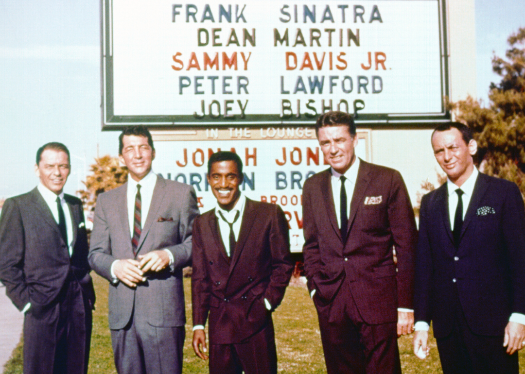 The Rat Pack pose by Sands Casino sign.
