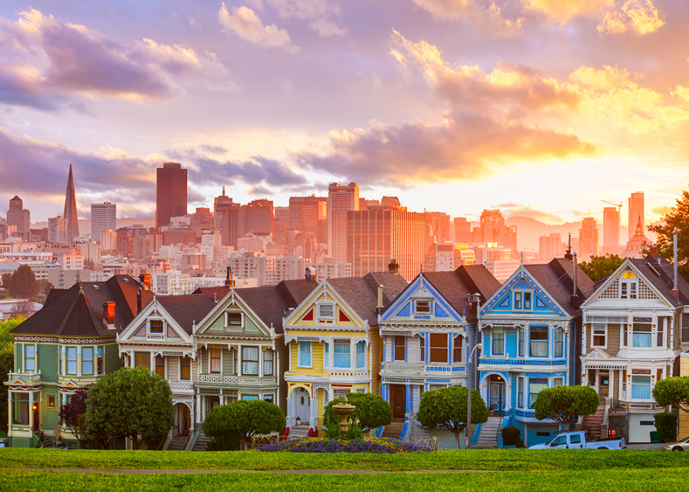 View of Painted Ladies and San Francisco skyline at sunset.