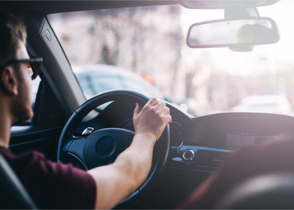 A man drives a car.