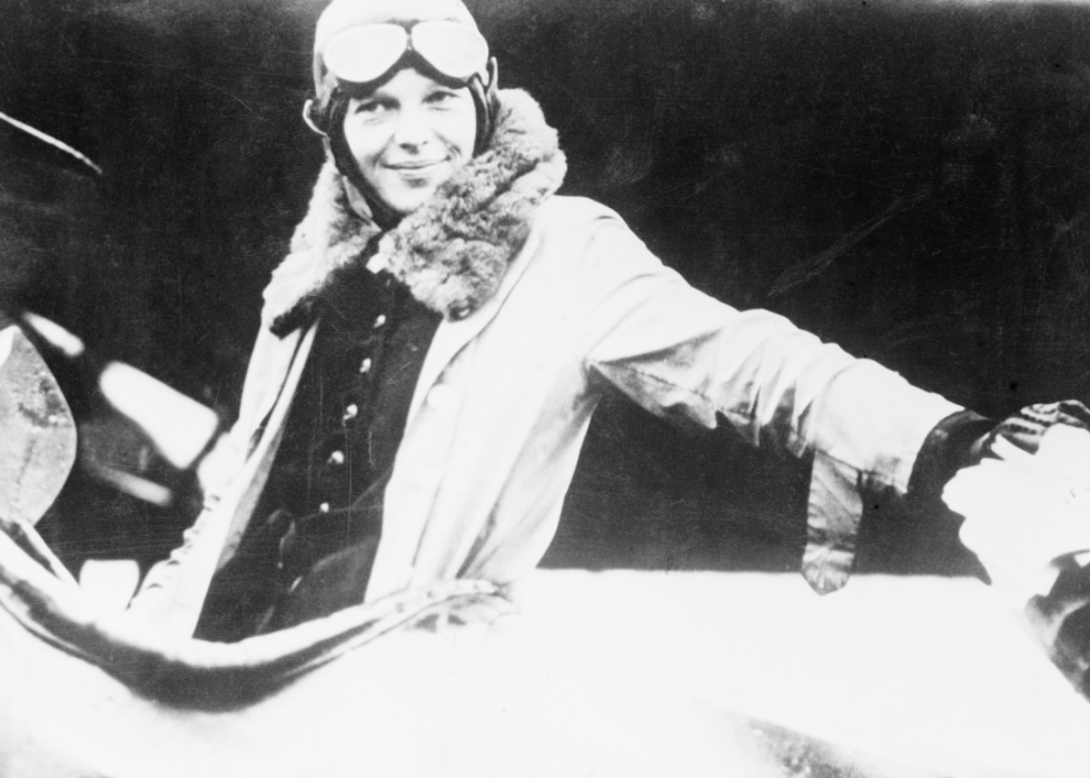 Amelia Earhart seated in aircraft