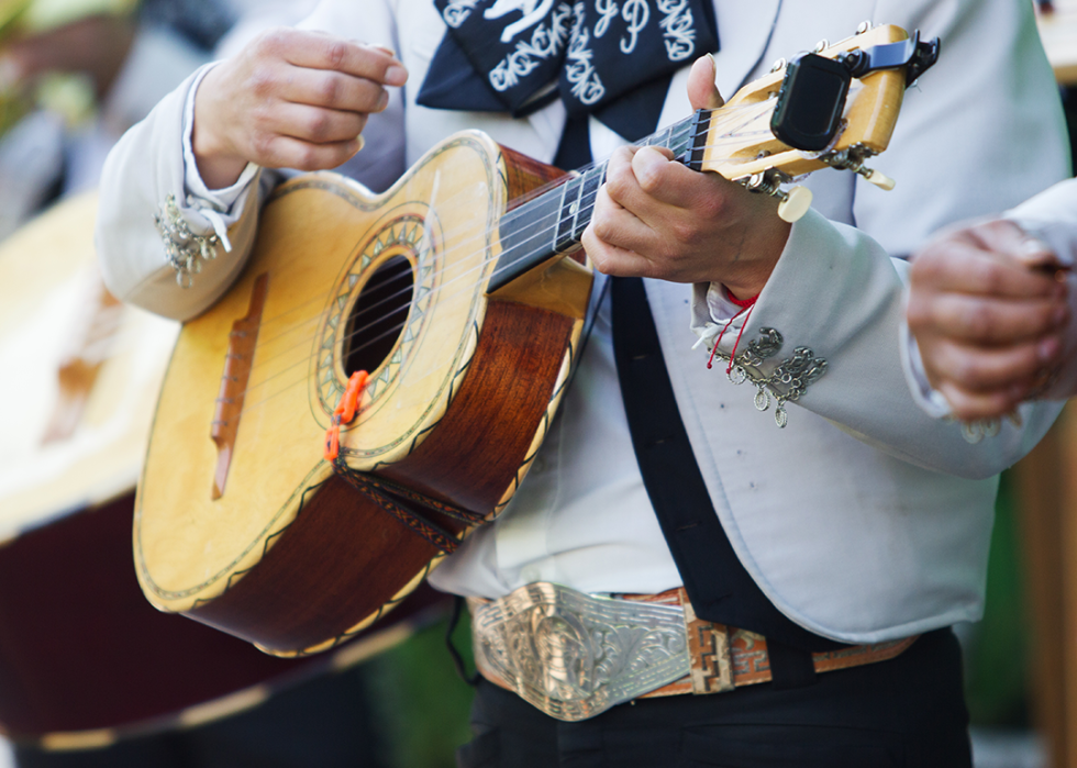 Cropped view of mariachi playing the vihuela.