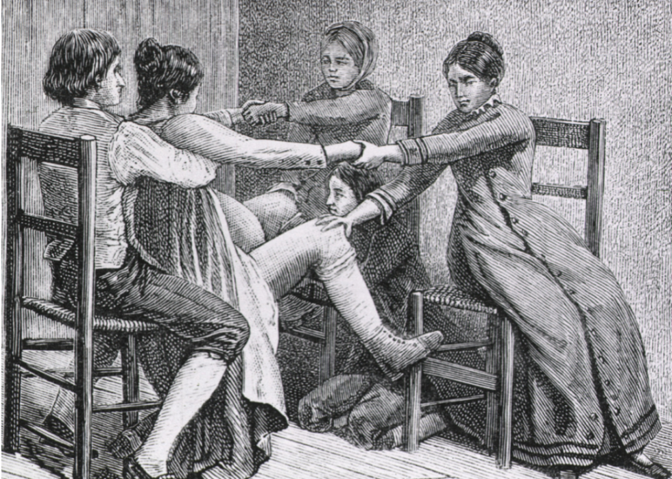 Illustration of two women and two men assisting in childbirth