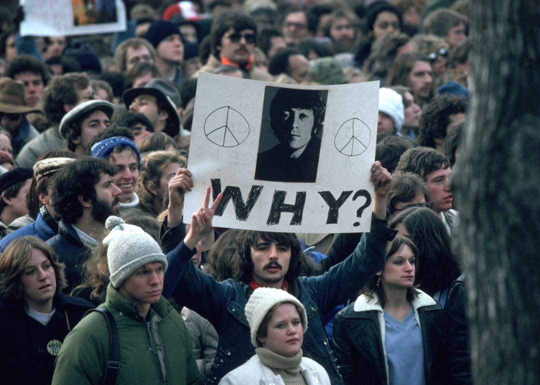 Fans of John Lennon holding a vigil at his home in New York.
