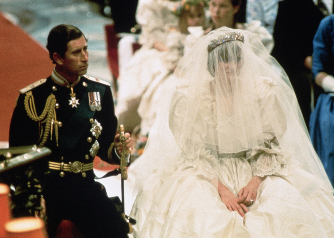 Prince Charles and Lady Diana Spencer seated during their wedding ceremony.