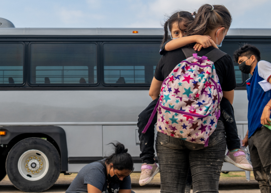 El Salvadorian migrants Yesenia Martinez and her daughter Jaretzy wait to be processed in Texas.
