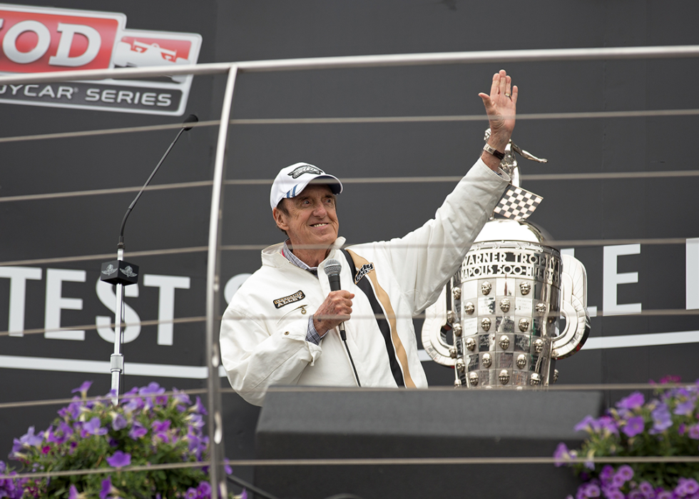 Jim Nabors holds the microphone and waves at the 2013 Indianapolis 500.