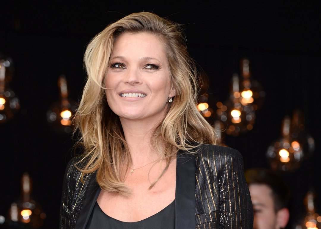 Kate Moss smiles at event
