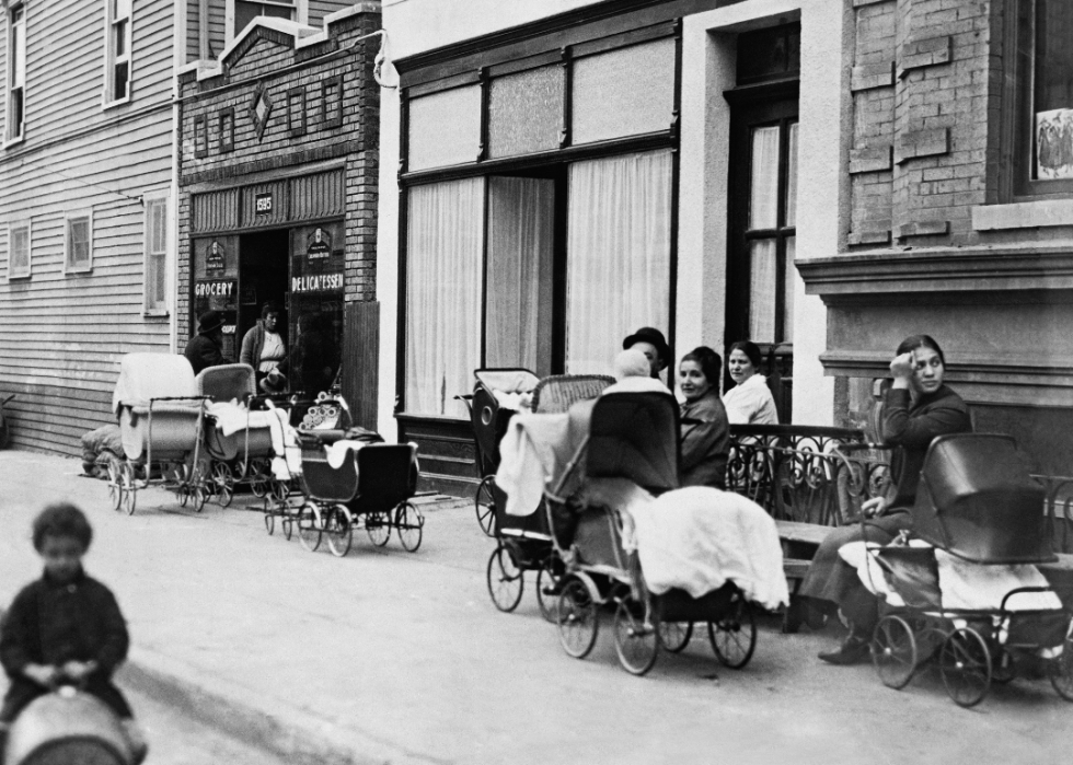 People with baby carriages in front of the Sanger Clinic