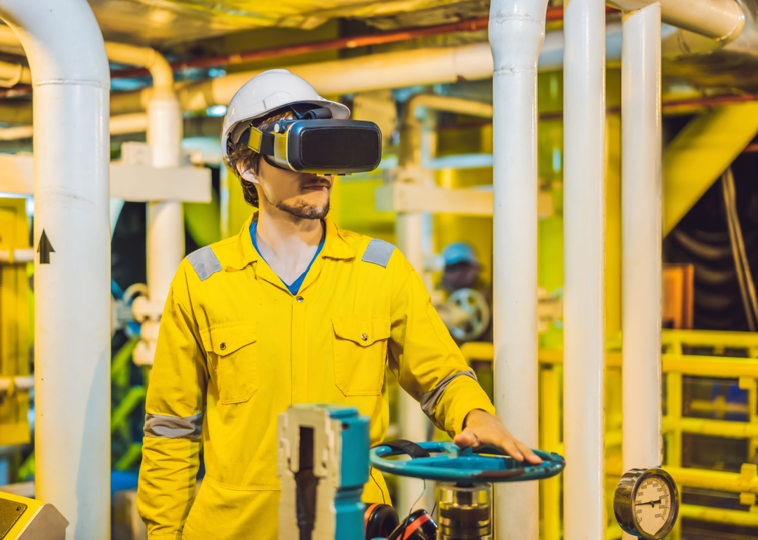Person wearing virtual reality glasses in industrial environment