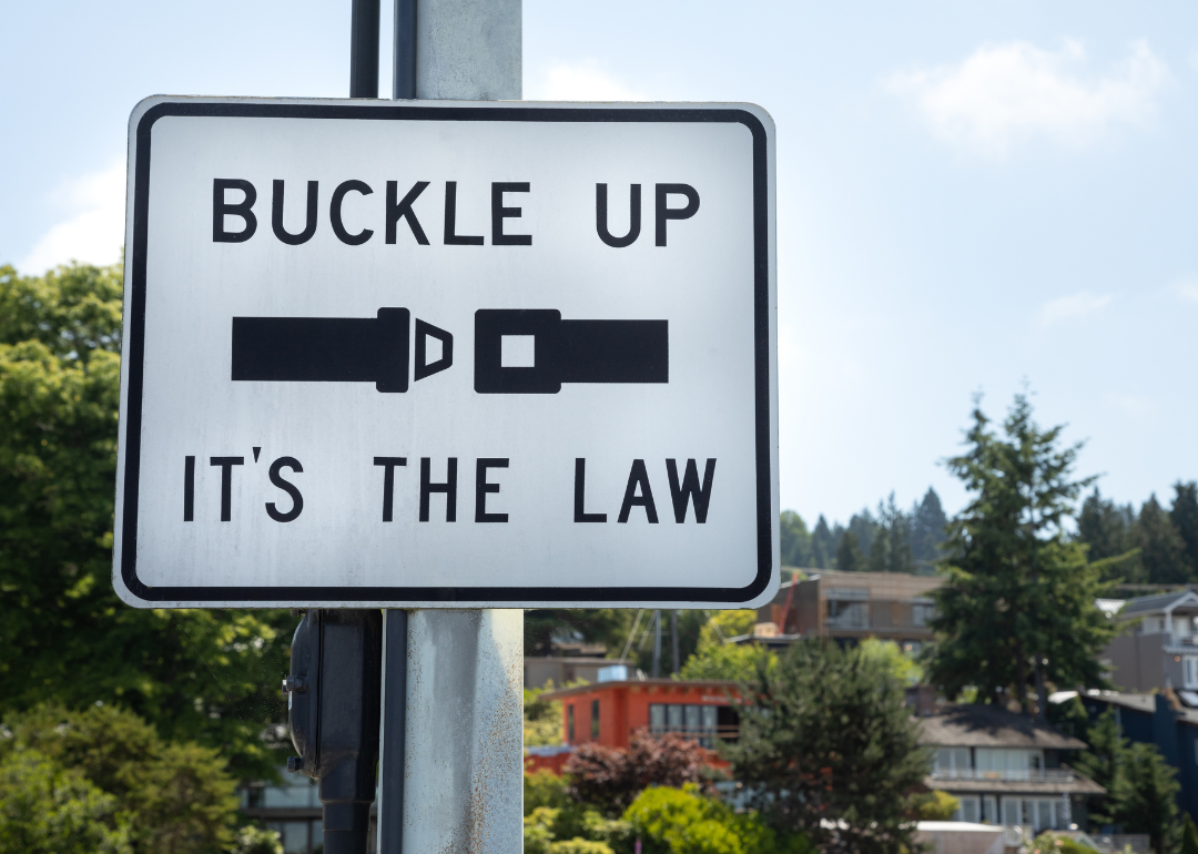 Close up on a "Buckle Up. Its The Law" sign
