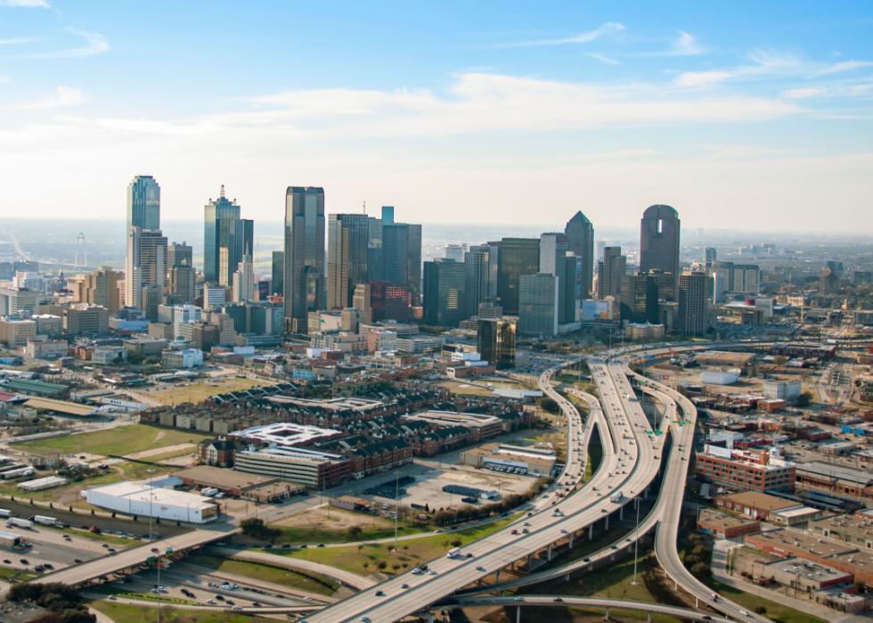 Aerial view of cityscape and highways.