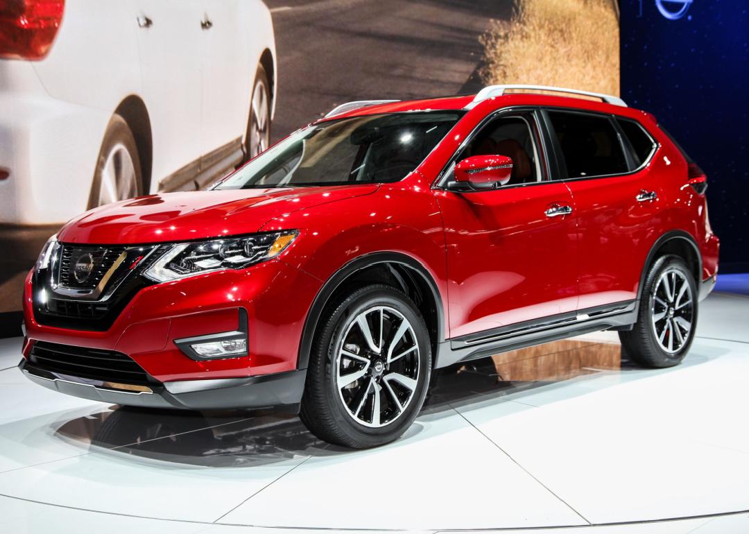 Red Nissan Rogue at auto show