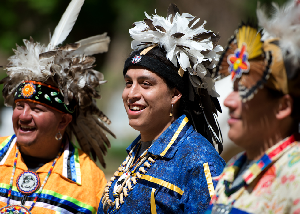 Members of the Oneida Indian Nation smile at a festival.