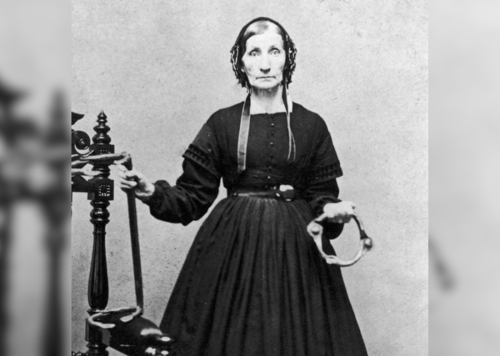 Portrait of Laura Smith Haviland holding slave irons.