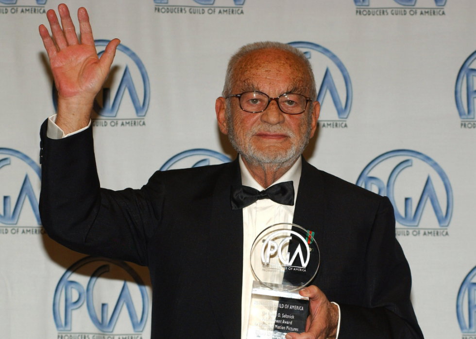 Dino De Laurentiis poses with Producers Guild award.