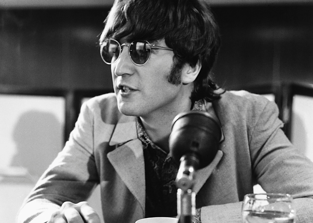 John Lennon speaks at a press conference.