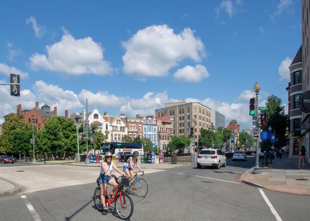 Cyclists cross Connecticut Ave NW in Dupont Circle neighborhood