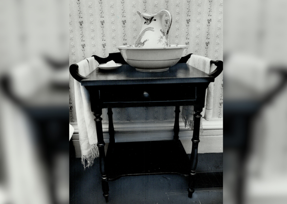 A mahogany washstand with Wedgwood china jug and bowl set.