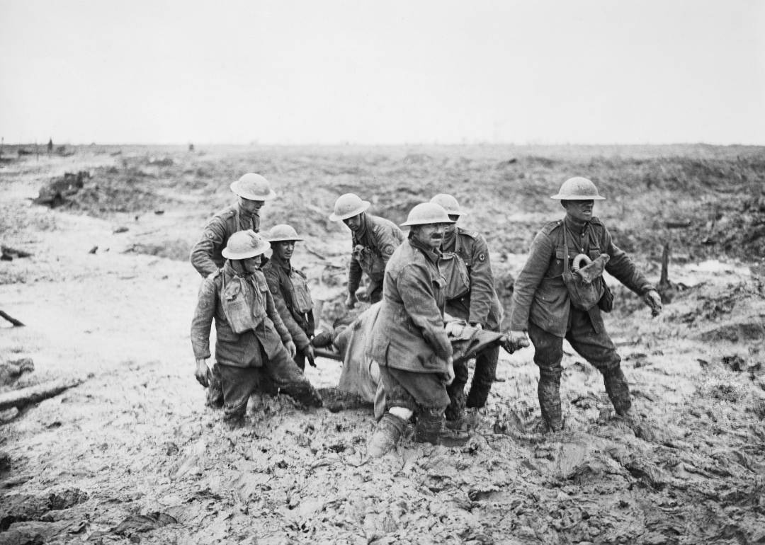 Stretcher bearers carry a wounded man to safety at The Third Battle of Ypres.