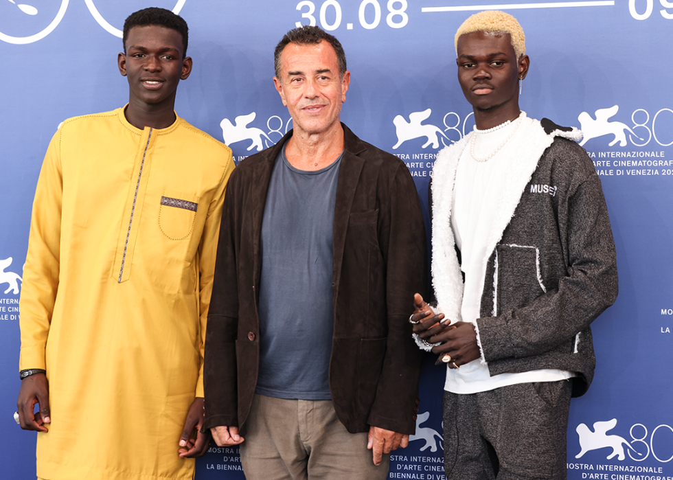 Seydou Sarr, Matteo Garrone, Moustapha Fall attend a photo call for "Io Capitano" at the Venice International Film Festival.