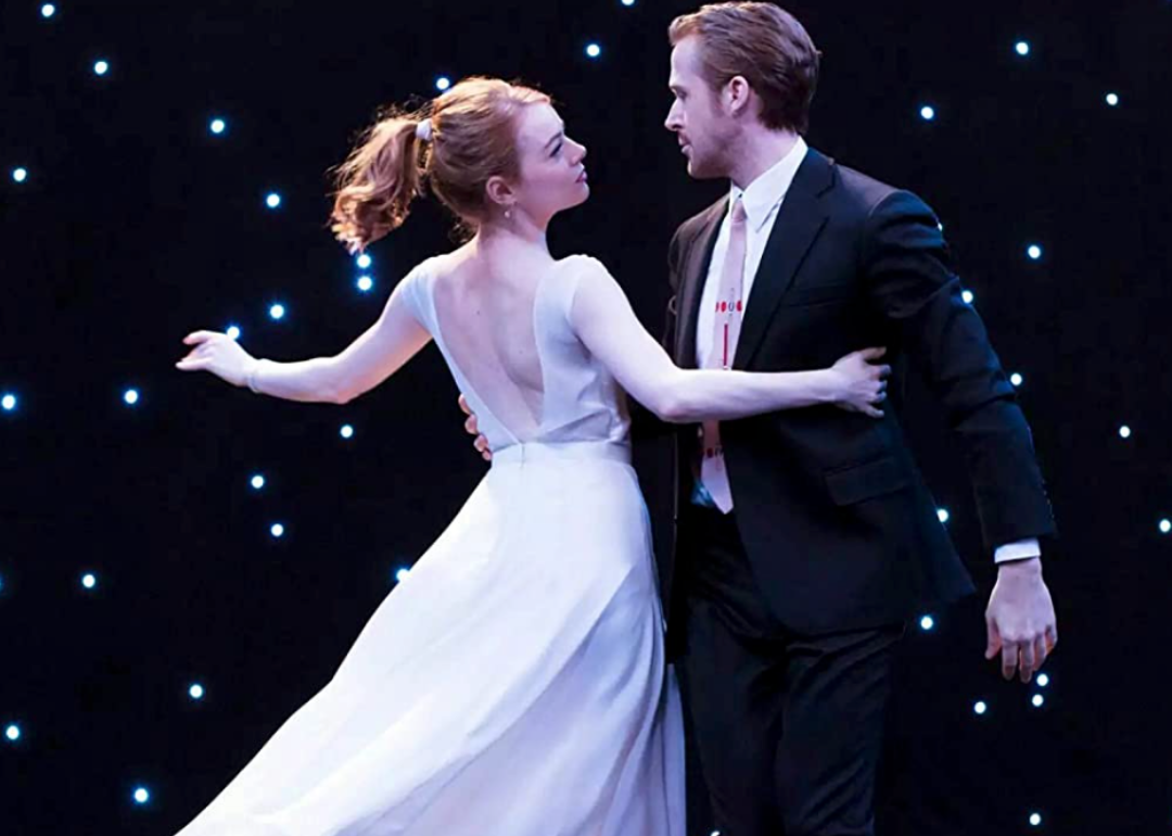 Actors Emma Stone and Ryan Gosling dancing in a scene from ‘La La Land.'
