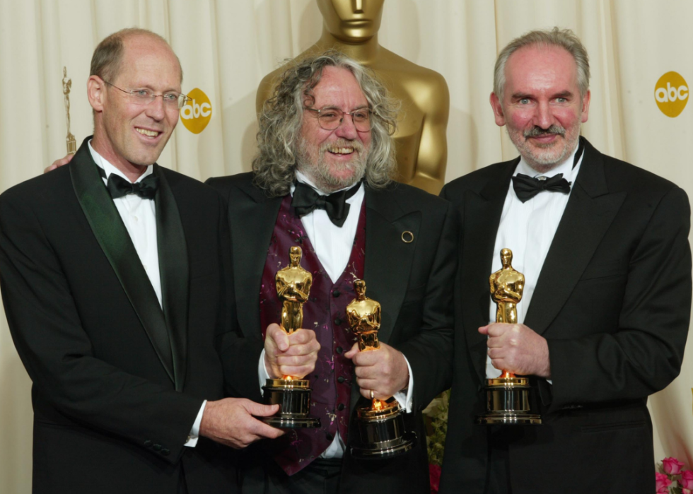 Grant Major, Dan Hennah, and Alan Lee pose with their Oscars.