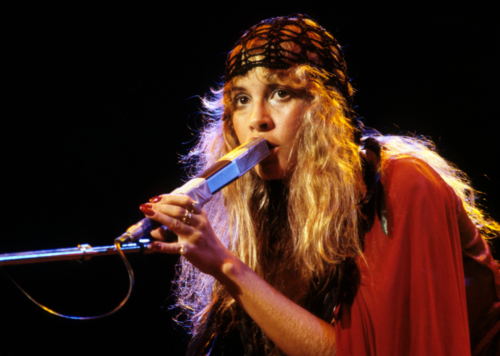 Stevie Nicks performing on stage with Fleetwood Mac.