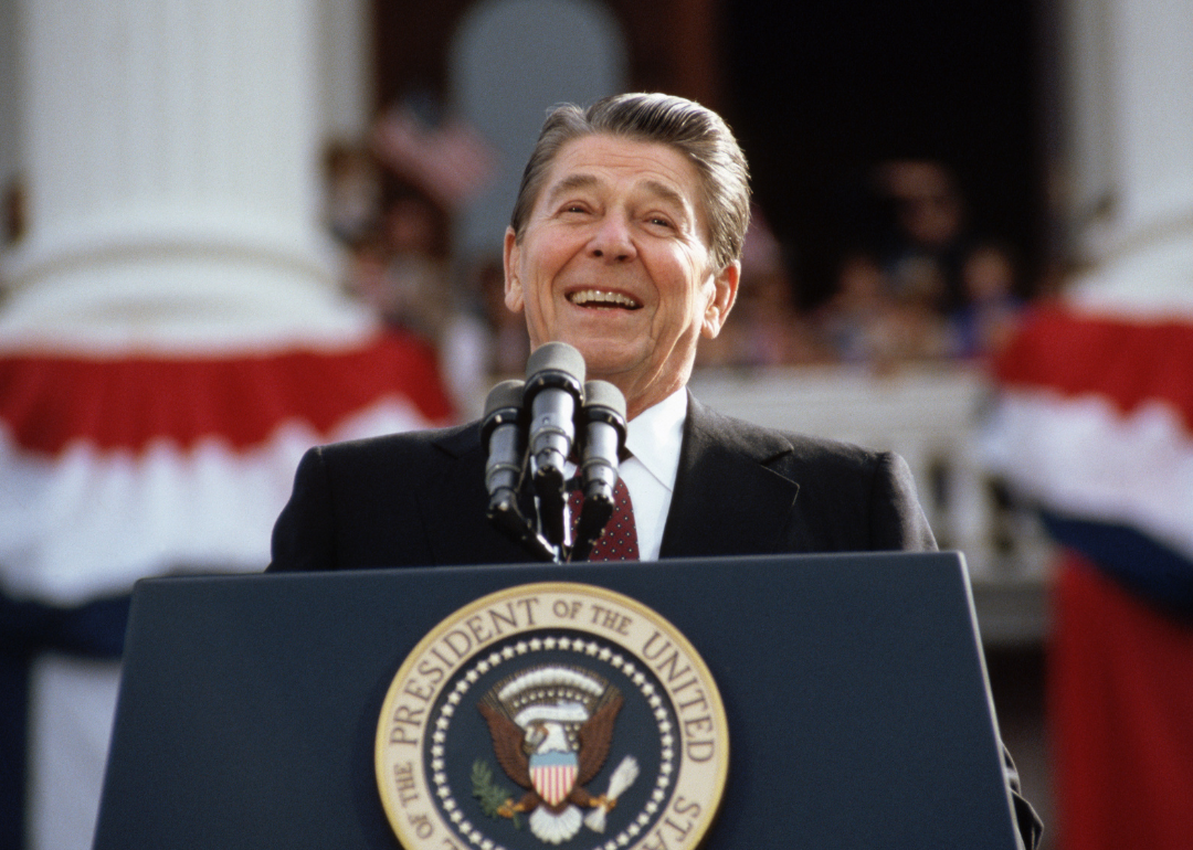 President Ronald Reagan smiles during a rally speech.