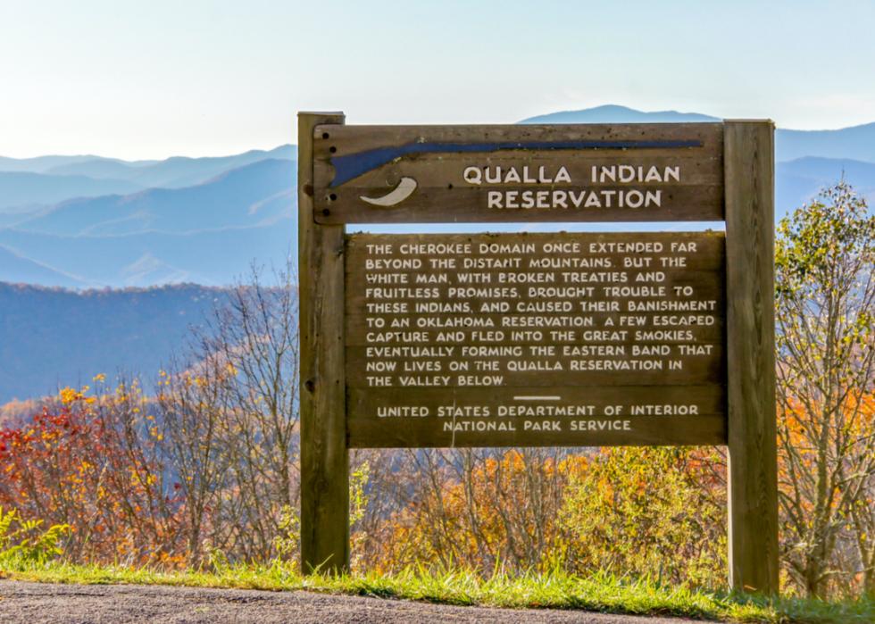 A wooden Nation Park Service sign for the Qualla Indian Reservation. 