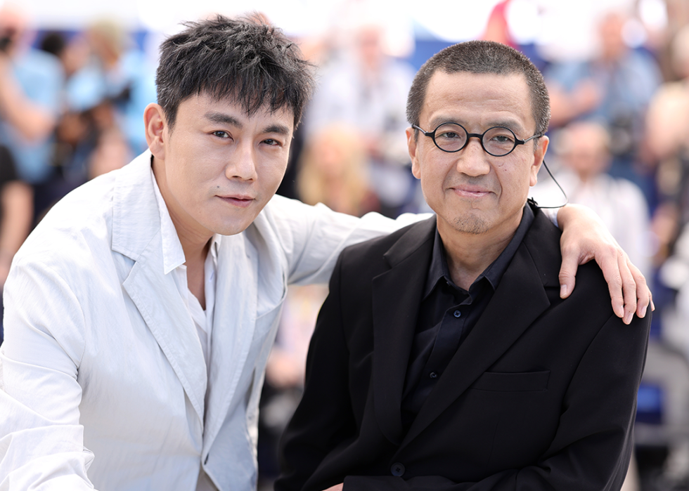 Qin Hao and Lou Ye attend the "An Unfinished Film" Photocall at the 77th annual Cannes Film Festival.