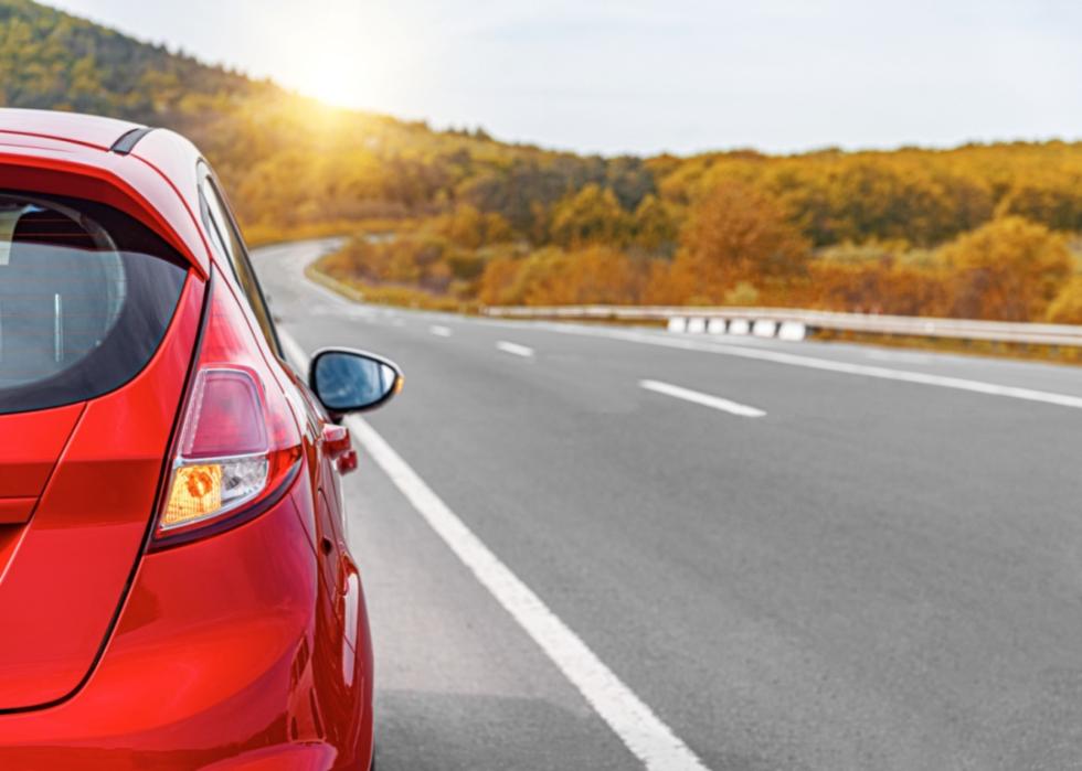 A red car on the highway.