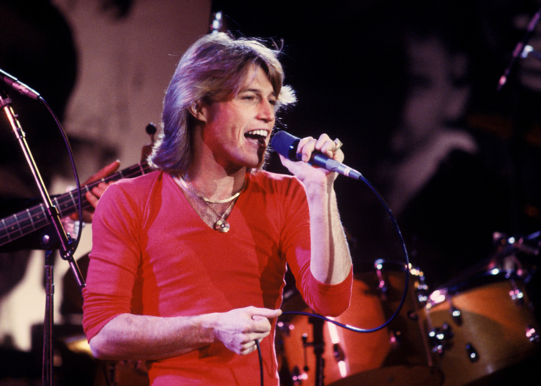 Andy Gibb performs onstage.