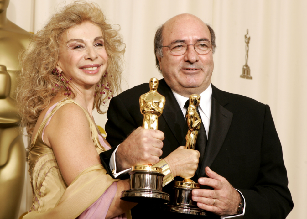 Francesca Lo Schiavo and Dante Ferretti pose with their Oscars.